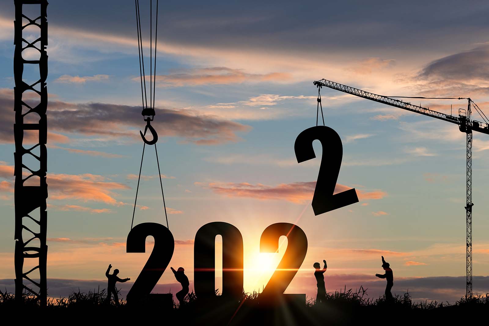 Silhouettes of people celebrating with large numbers "202" set against a sunset, with crane and construction elements, hinting at the arrival of a new year, 2023.