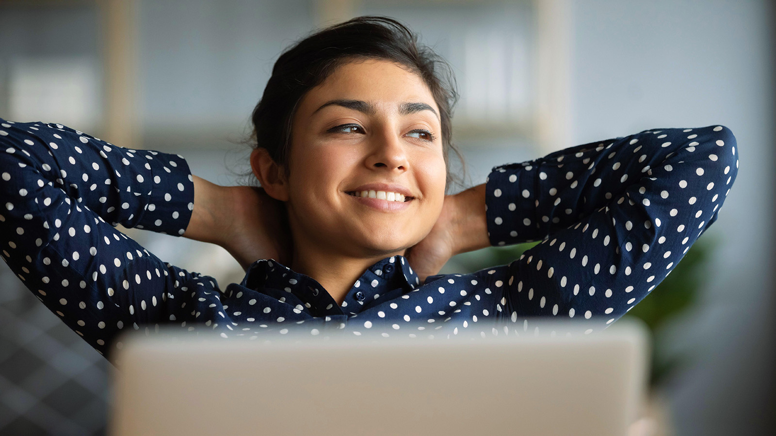 smiling woman working at computer