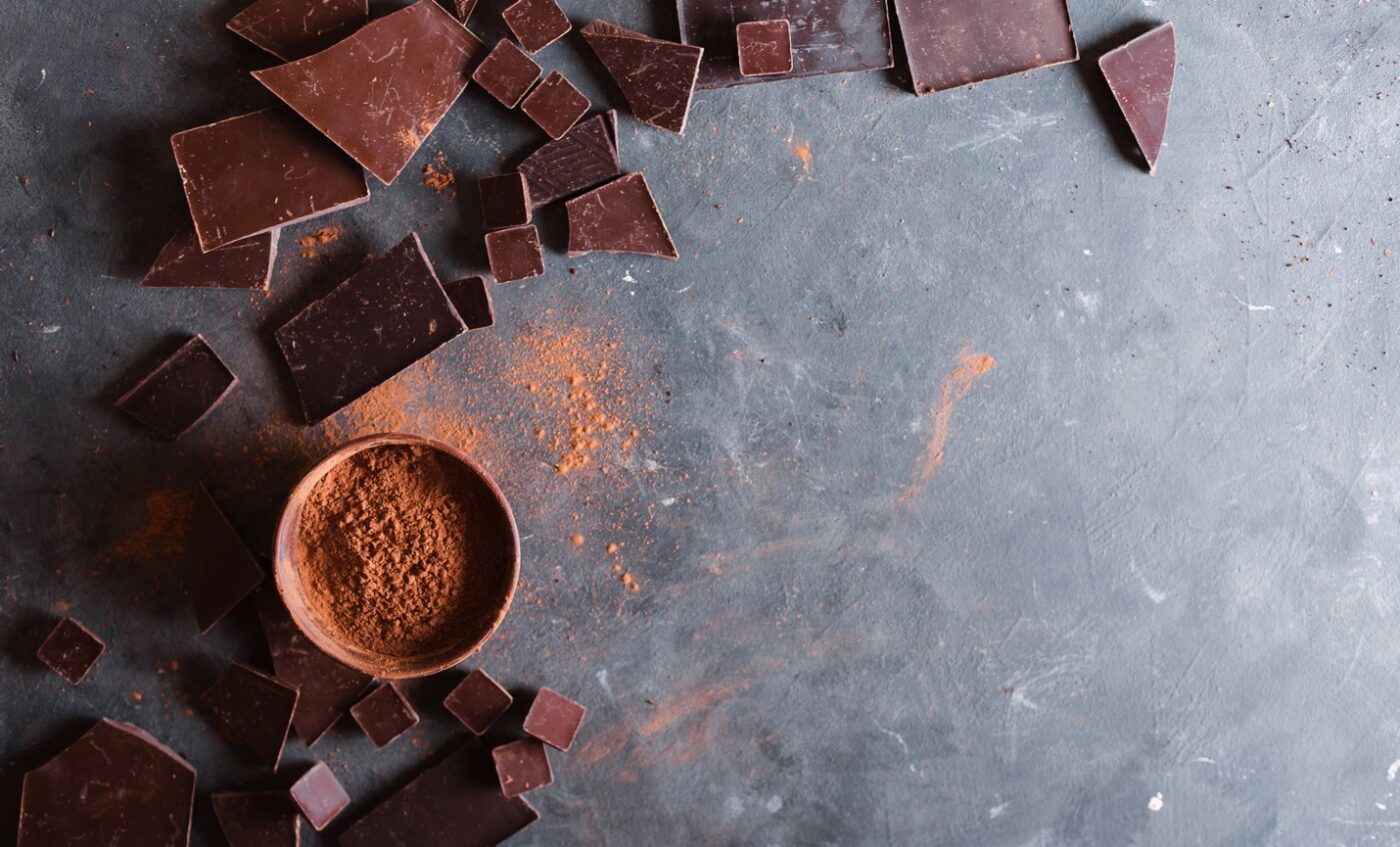 chocolate bar chunks and cocoa powder on a slate slab