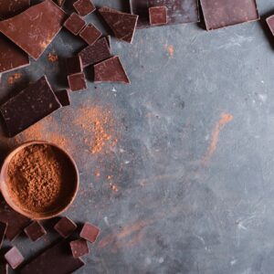 chocolate bar chunks and cocoa powder on a slate slab