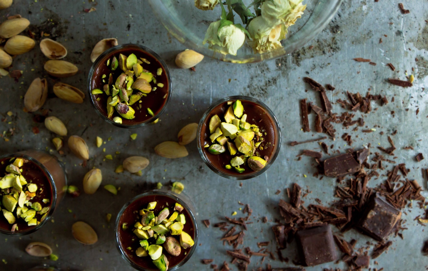 chocolate nibs and pistachio nuts on a slate slab