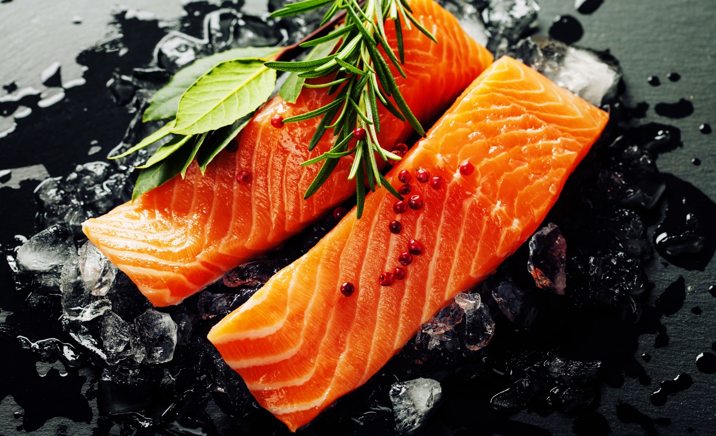 salmon filets spiced and ready for cooking