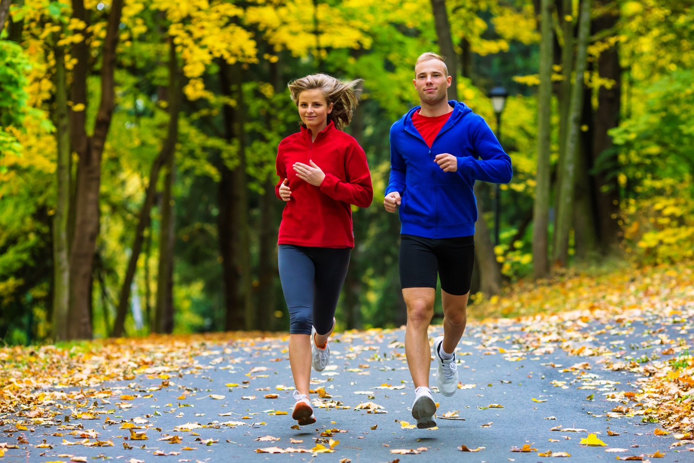 couple jogging on an outdoor park path